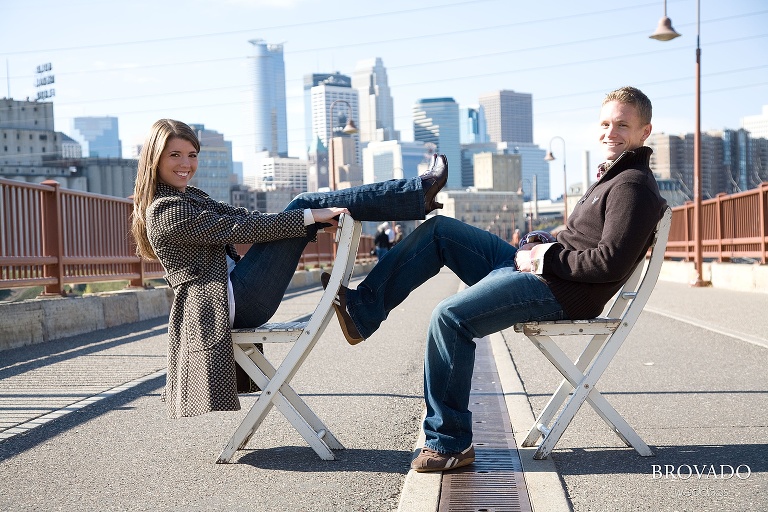 Goofy engaement poses on the stone arch bride