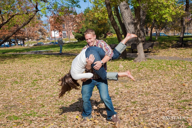 playful wrestling during engagement shoot