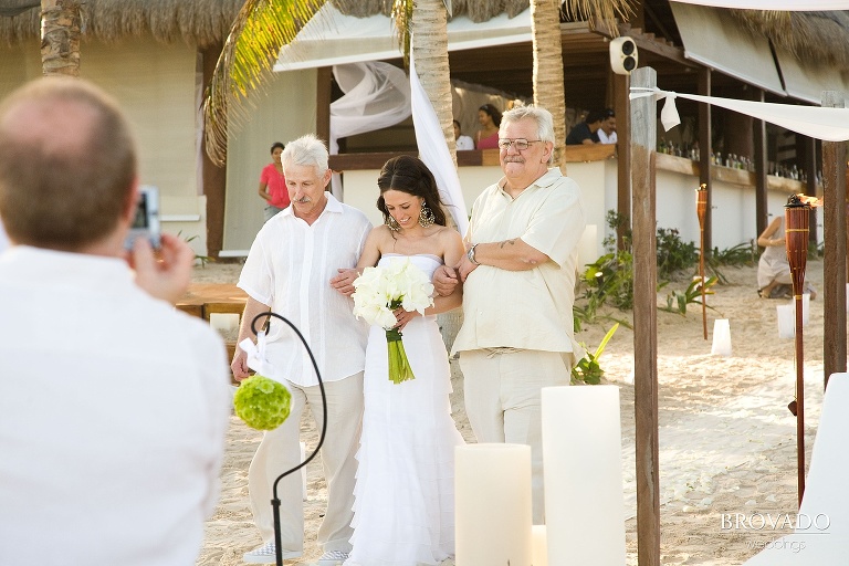 bride being walked down the aisle at destination wedding