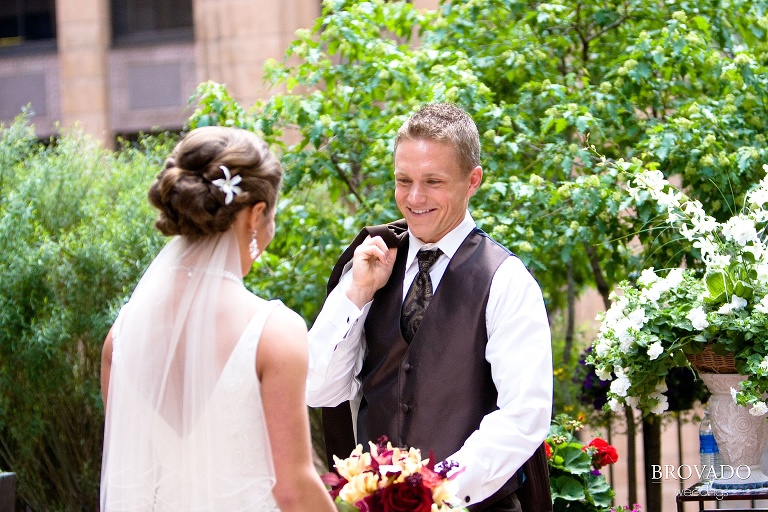 groom smiling when seeing the bride for the first time