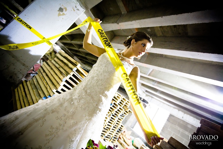 bride poses with caution tape