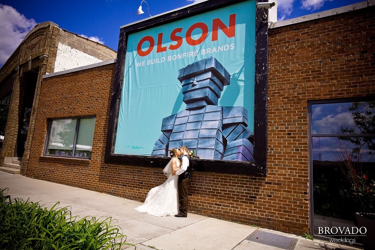 bride and groom kiss in a wide angle shot