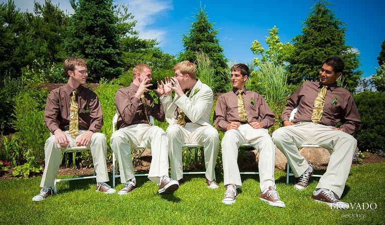 groomsmen pose in chairs