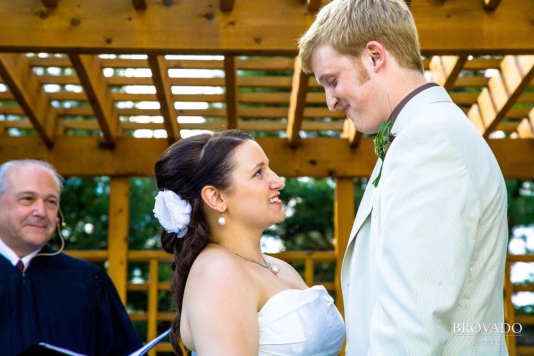 bride and groom sharing a glance during their wedding ceremony