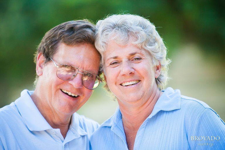 couple laughs with their heads together