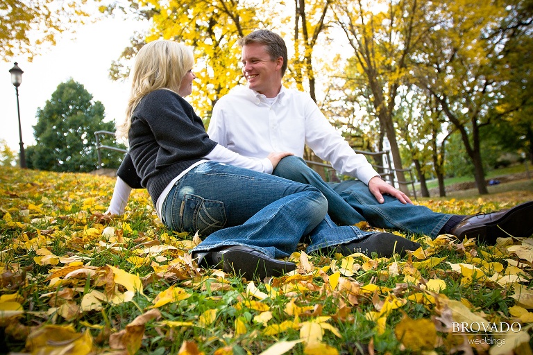 engaged couple poses on leaves
