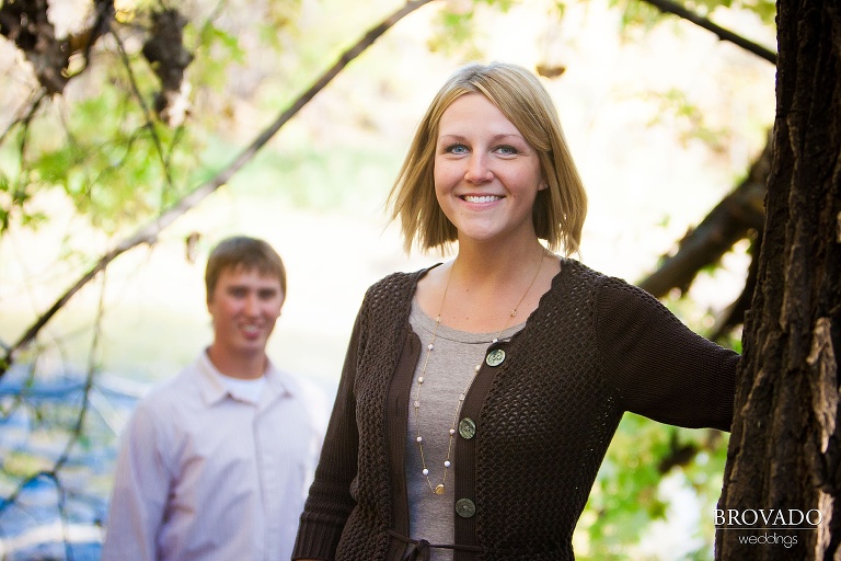 woman poses in front of her fiance