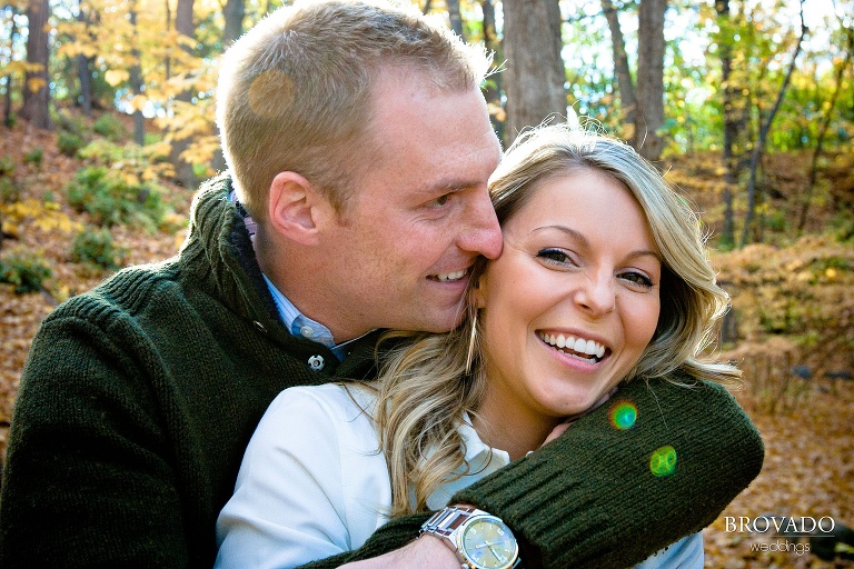 couple embrace during fall at minnehaha dog park