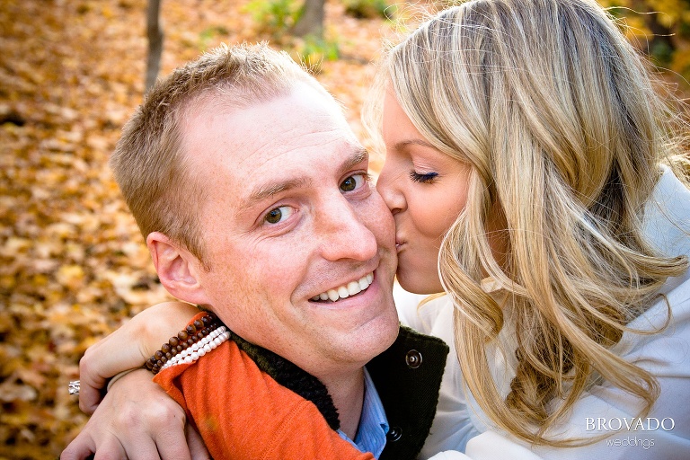 close up of woman kissing her fiance on the cheek