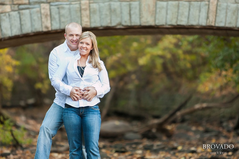 couple pose by minnehaha bridge