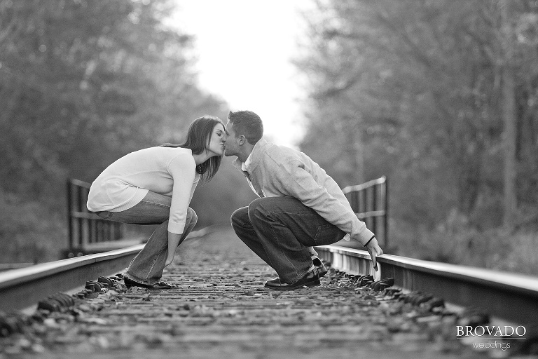 couple kiss on train tracks