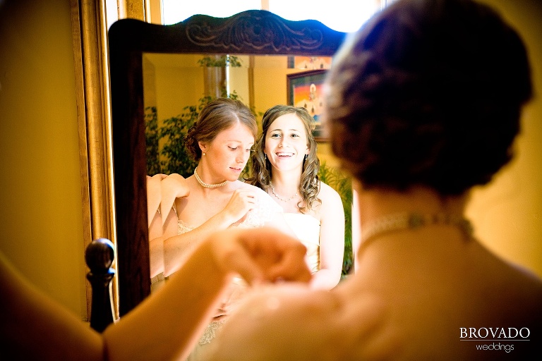 bride looking into mirror