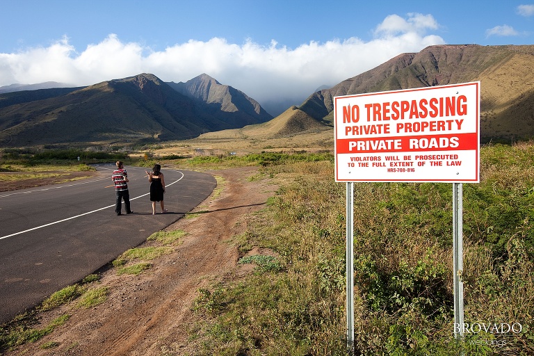 couple walking past no trespassing sign