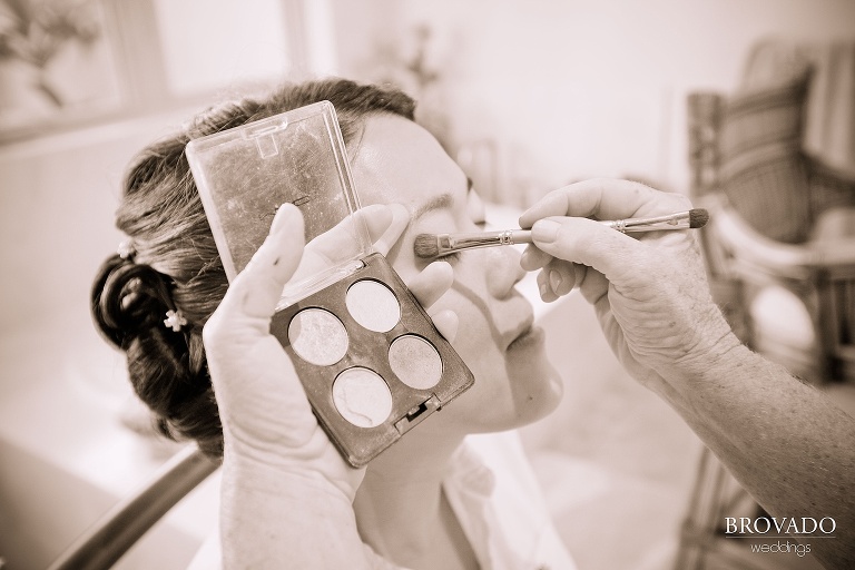 bride getting makeup done