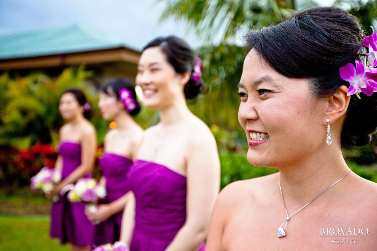 smiling bridesmaids in purple dresses