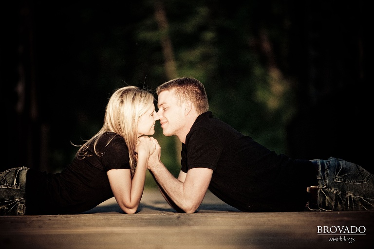 couple kissing laying on their stomachs