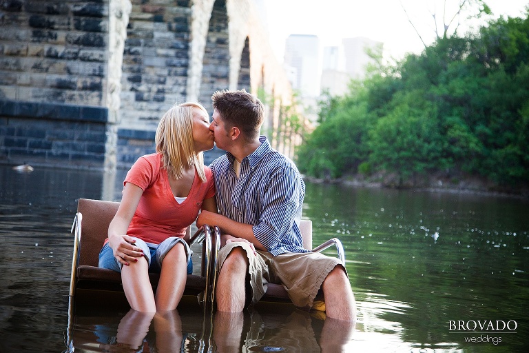 engagement photography of couple sitting in mississippi river