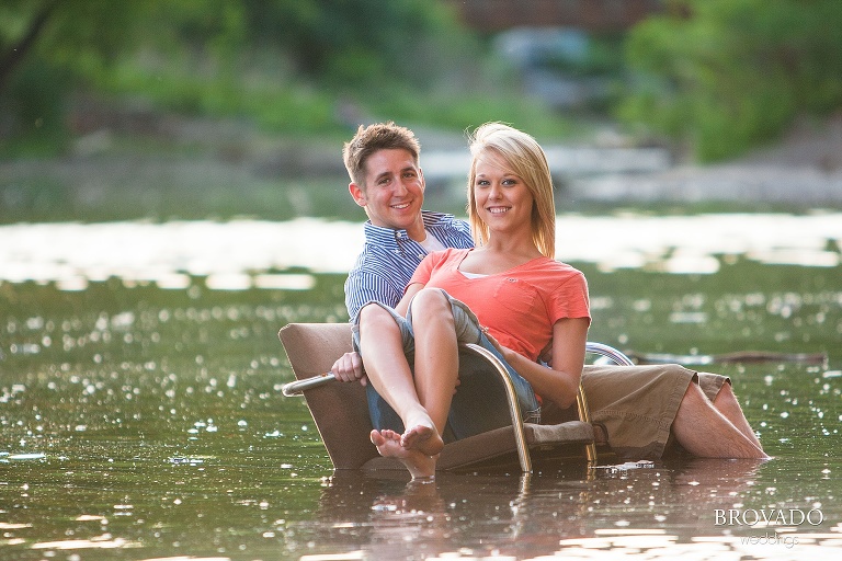 engagement photography of couple sitting in mississippi river