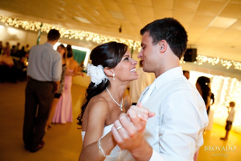 bride and groom laughing on the dance floor