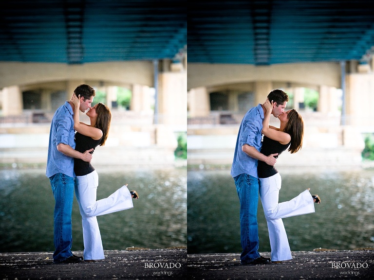 engaged couple kissing under downtown minneapolis overpass