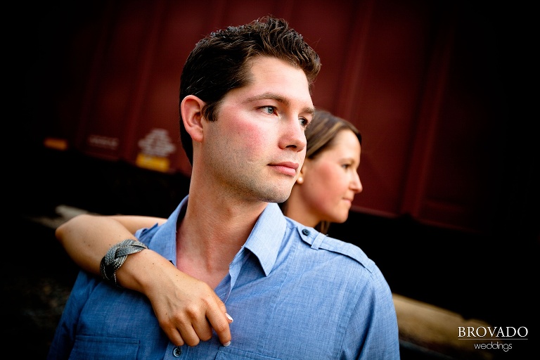 dramatic close up photograph of fiance in front of his bride to be