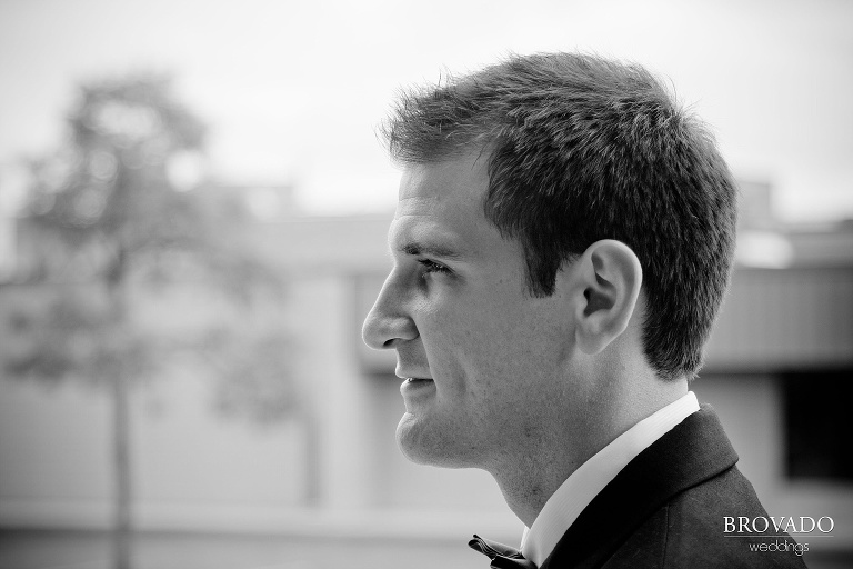 dramatic black and white profile photograph of the groom