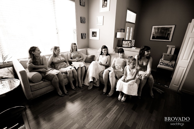 sepia photograph of bride and bridesmaids relaxing before ceremony