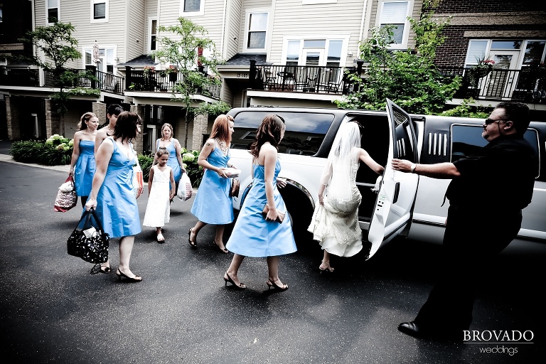 high contrast photo of bride and her bridesmaids getting in limo