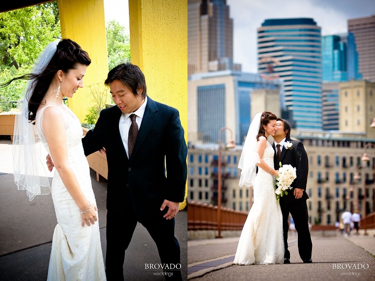 photography of groom kissing bride in front of minneapolis skyline