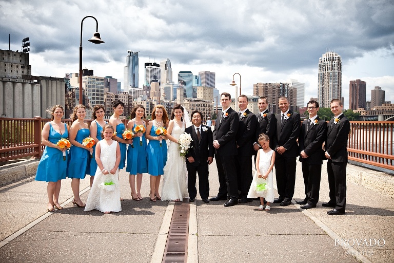 wedding party photography on stone arch bridge