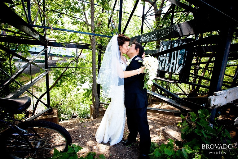 high contrast photograph of bride and groom in front of minneapolis graffiti 