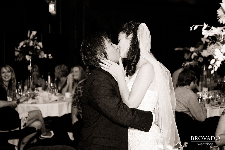 bride and groom kiss during first dance