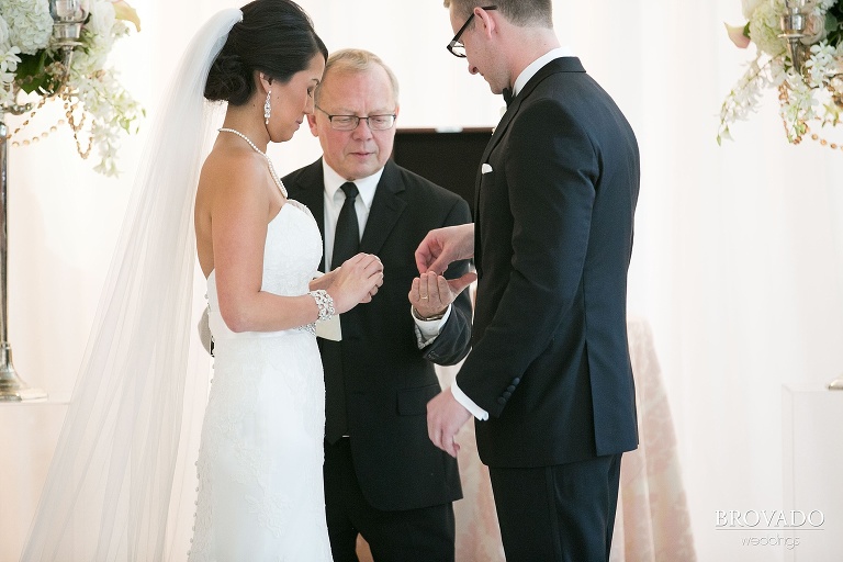 Downtown Minneapolis Wedding Photography at Le Meridien Hotel exchanging rings