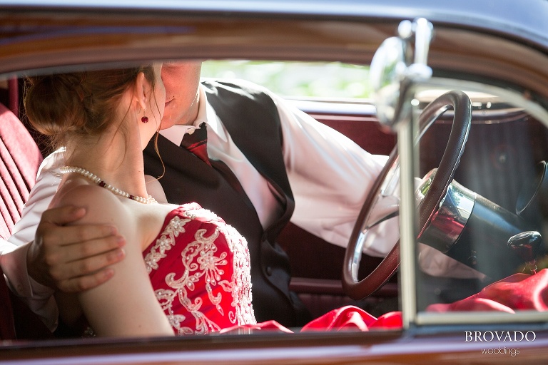 Untraditional aviation wedding with a red dress on a sunny day at the Gale Mansion in Minneapolis Minnesota