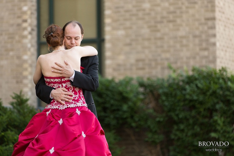Untraditional aviation wedding with a red dress on a sunny day at the Gale Mansion in Minneapolis Minnesota