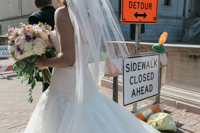Bride and groom walk through downtown st. paul