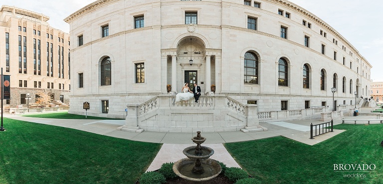 Bride and groom sit on historic st paul building