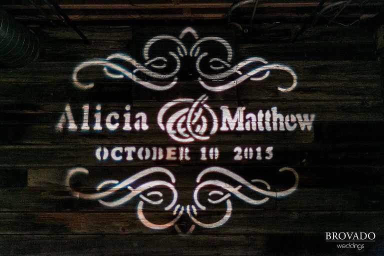 Bride and grooms name and wedding date are projected at their ceremony