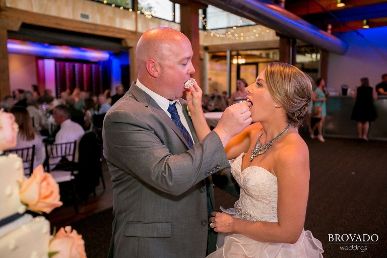 Peach and Navy themed wedding with  stunning details shot at the Minneapolis Event Center in Minneapolis, MN cake cutting
