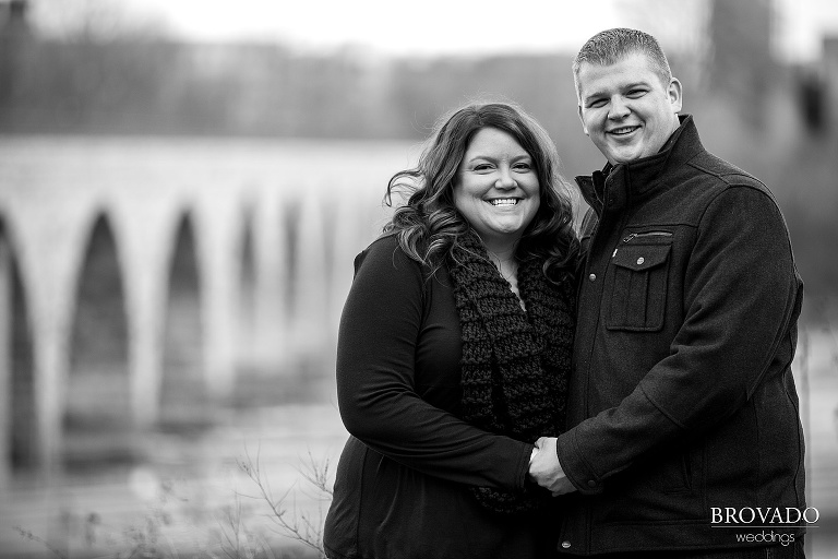 Black and white stone arch bridge engagement