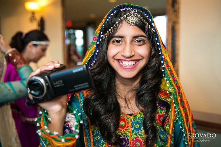 Wedding guest taking video of indian reception