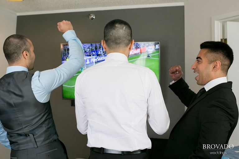 Groomsmen enjoying sports before wedding ceremony