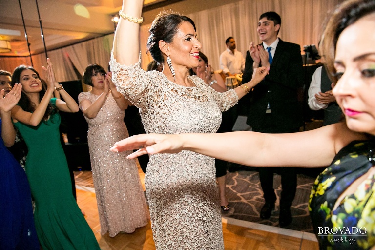 Dancing wedding party guests