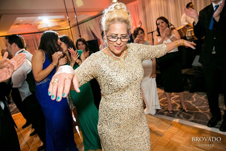 dancing wedding reception guest