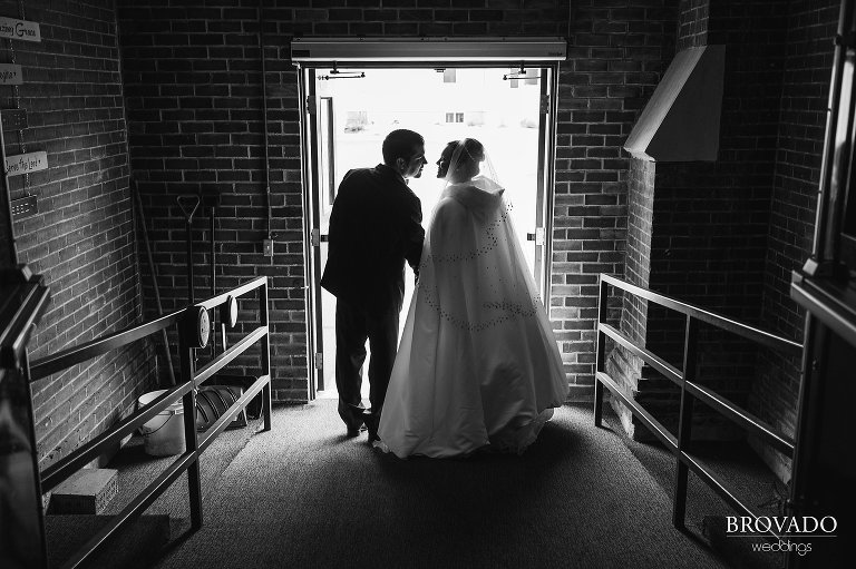 Newlyweds leaning in for the kiss