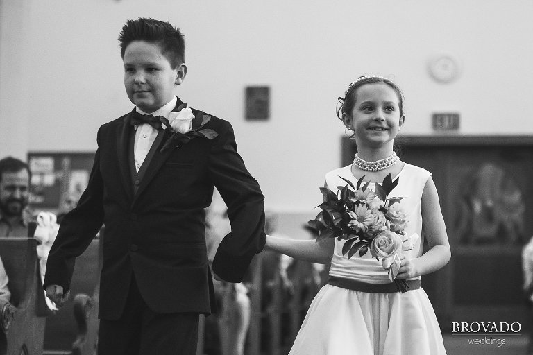 Flower girl and ring bearer walking down the aisle