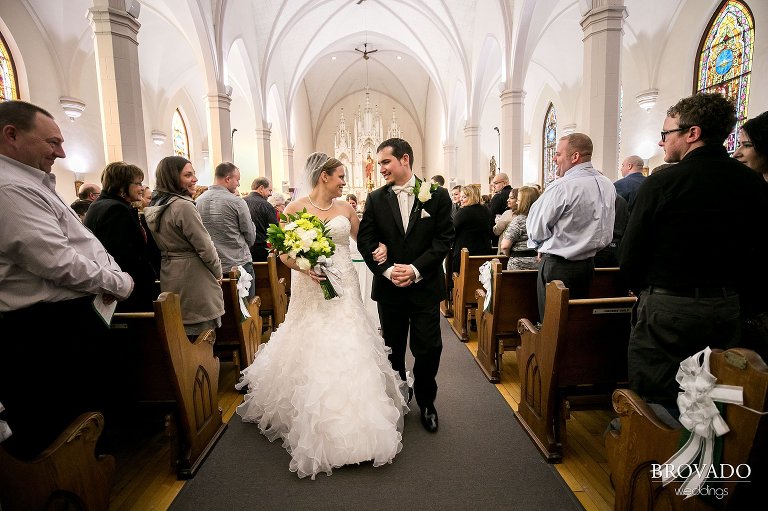 Bride and groom walking down the aisle