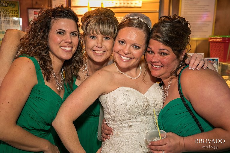 Heidi and the bridesmaids smiling at the bar