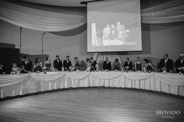 Bride and groom kissing at front of reception