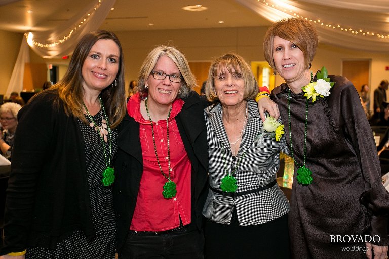 Wedding guests posing in st patrick's day jewelry 